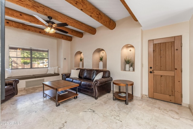 living room featuring ceiling fan and beam ceiling