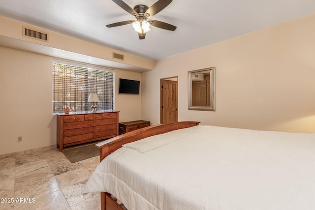 bedroom with ceiling fan and visible vents
