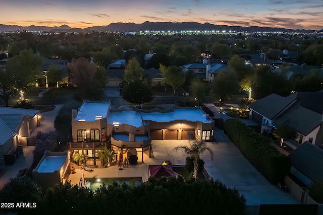 aerial view at dusk with a residential view and a mountain view