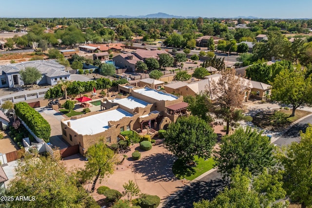birds eye view of property featuring a mountain view and a residential view