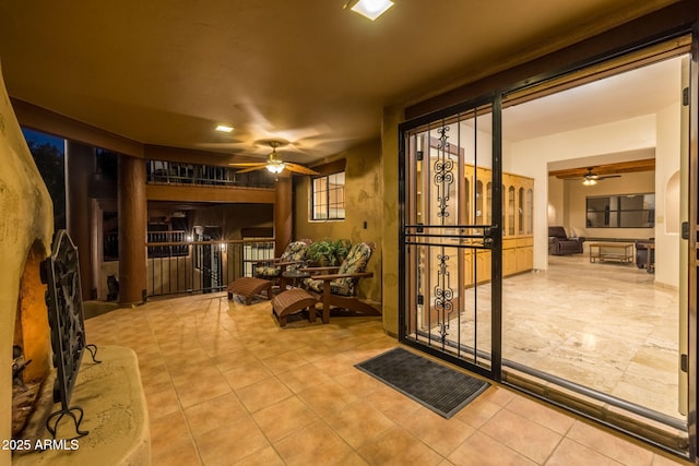 interior space featuring ceiling fan