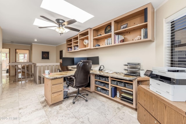 office space with crown molding, a skylight, and ceiling fan
