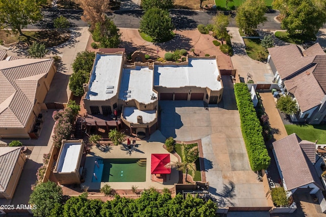 birds eye view of property with a residential view