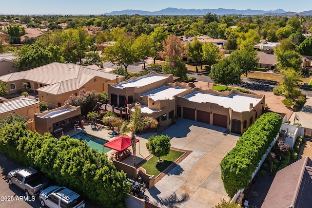 drone / aerial view with a residential view and a mountain view