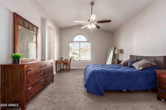 carpeted bedroom featuring ceiling fan and vaulted ceiling