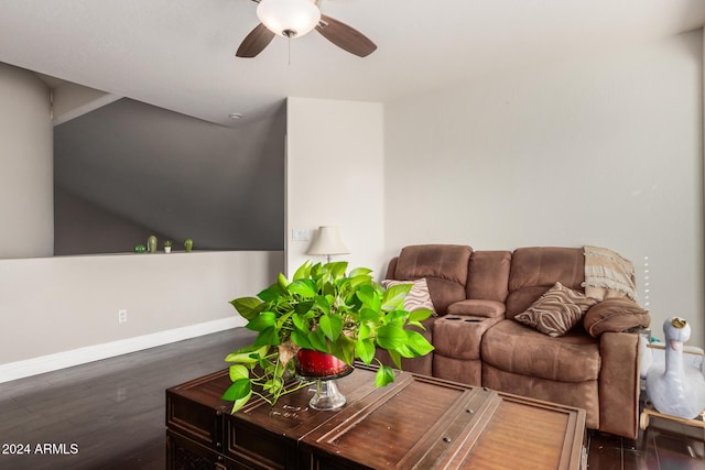 living room with dark hardwood / wood-style floors and ceiling fan