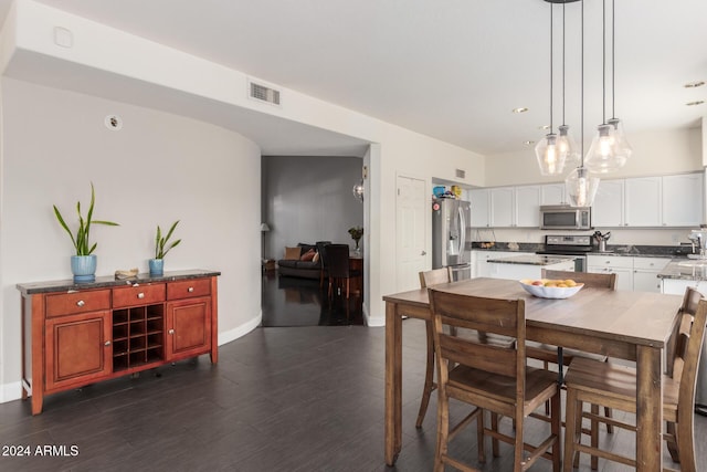 dining room featuring dark wood-type flooring