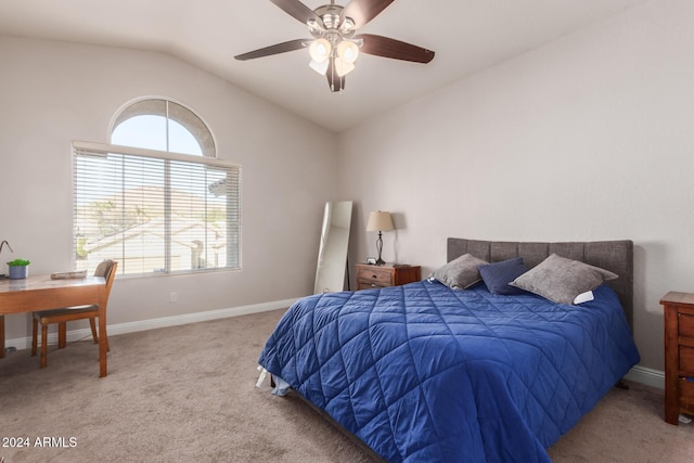 bedroom with ceiling fan, light colored carpet, and vaulted ceiling