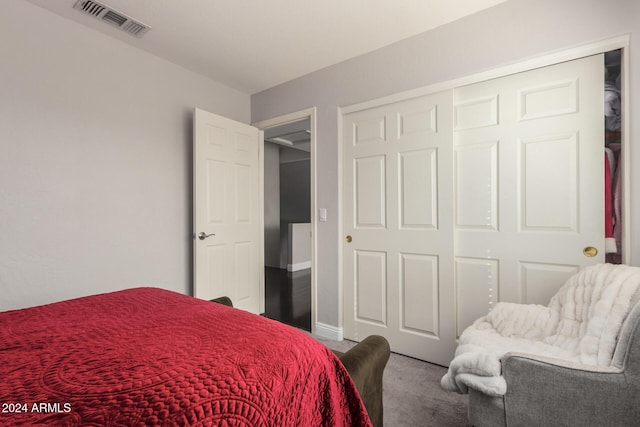 carpeted bedroom featuring a closet