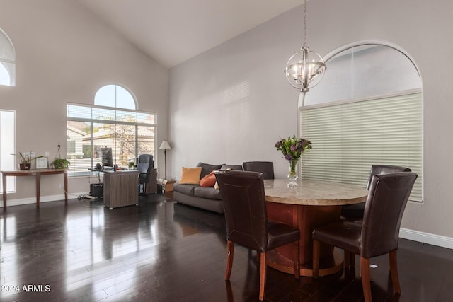 dining space with an inviting chandelier, dark hardwood / wood-style floors, and high vaulted ceiling