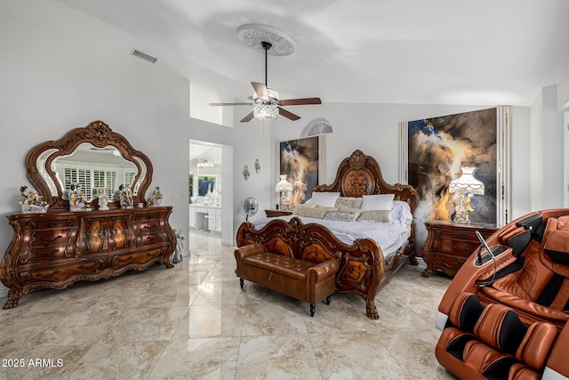 6941 W Voltaire Ave, Peoria, AZ 85381 - bedroom featuring marble tiled flooring, vaulted ceiling, ensuite bathroom, and ceiling fan