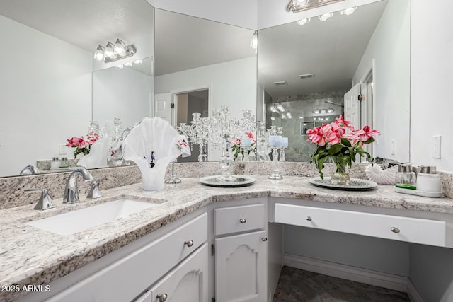 6941 W Voltaire Ave, Peoria, AZ 85381 - bathroom with vanity, a stall shower, and tile patterned flooring