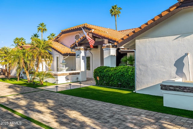 6941 W Voltaire Ave, Peoria, AZ 85381 - view of front of house with a tile roof, stucco siding, and a front lawn