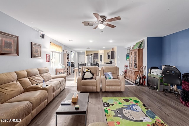 living area featuring recessed lighting, ceiling fan, and wood finished floors