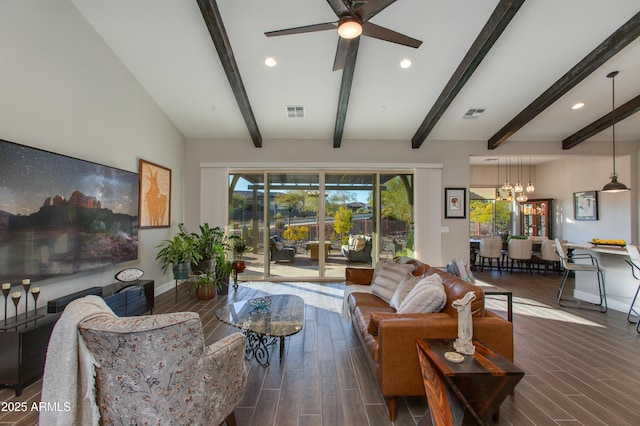 living room with ceiling fan with notable chandelier and lofted ceiling with beams