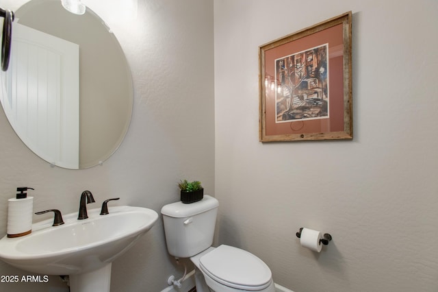 bathroom with sink and toilet