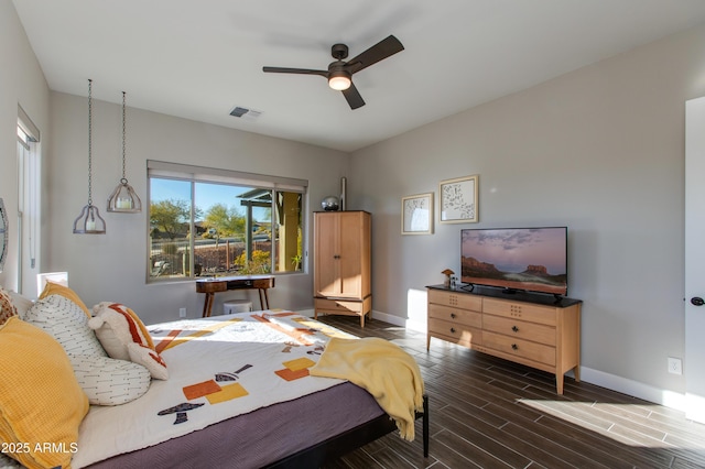 bedroom with multiple windows and ceiling fan