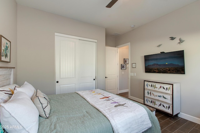 bedroom with ceiling fan and a closet