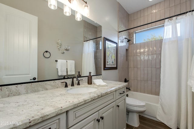 full bathroom with toilet, vanity, shower / tub combo, and hardwood / wood-style flooring