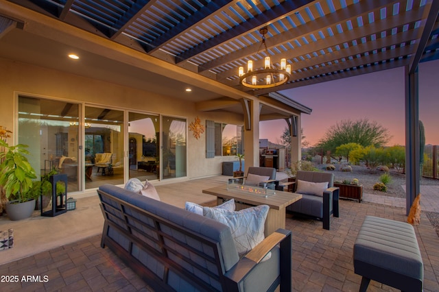 patio terrace at dusk with a pergola and an outdoor living space