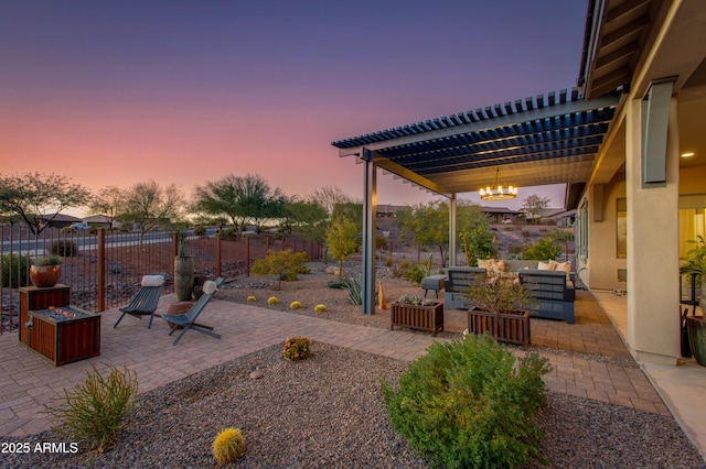 patio terrace at dusk with a pergola and outdoor lounge area