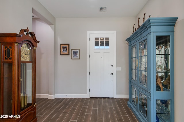 foyer with dark hardwood / wood-style flooring