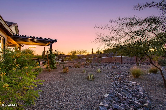 view of yard at dusk