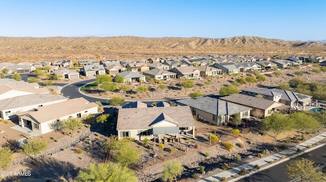 birds eye view of property with a mountain view