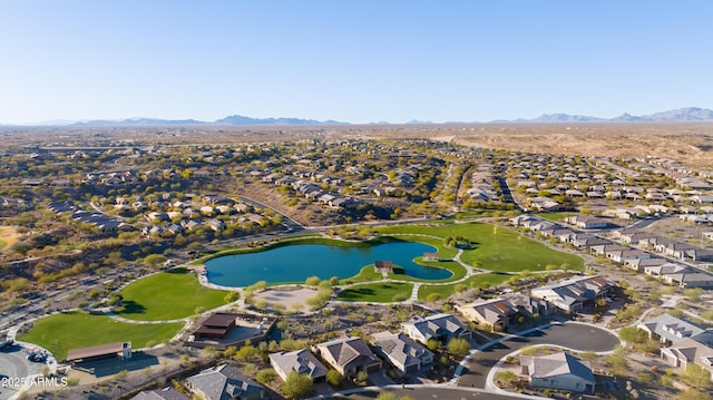 drone / aerial view featuring a water and mountain view