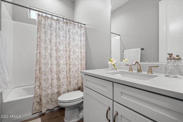 full bathroom featuring shower / bathtub combination with curtain, vanity, toilet, and hardwood / wood-style floors