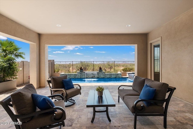 view of patio / terrace with pool water feature and a fenced in pool