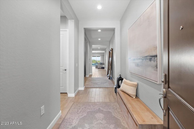 hallway with light wood-type flooring