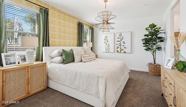 bedroom with dark colored carpet