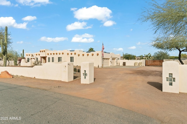 adobe home featuring a garage