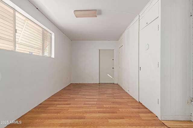 hall with light wood-type flooring