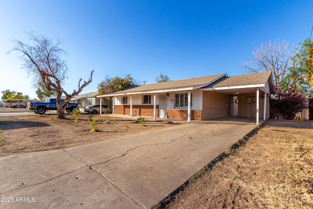 ranch-style house with a carport and covered porch