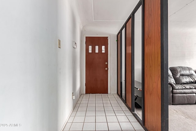 hallway with light tile patterned floors