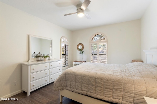 bedroom featuring ceiling fan and dark hardwood / wood-style flooring