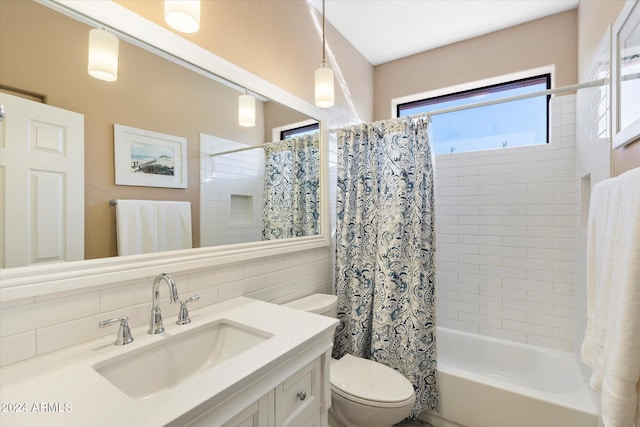 full bathroom with shower / bath combo, vanity, toilet, tile walls, and tasteful backsplash