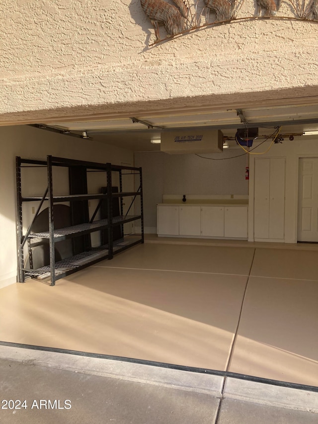 garage featuring a garage door opener