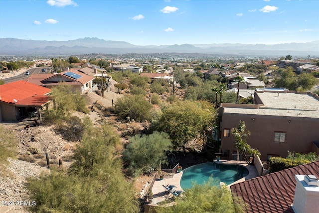 birds eye view of property featuring a mountain view