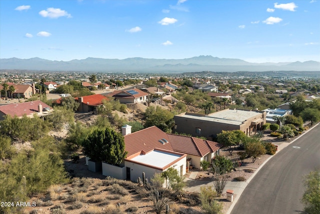 birds eye view of property featuring a mountain view