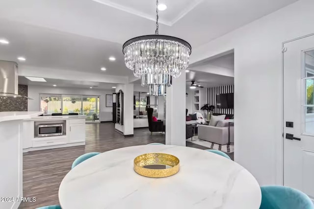 dining room featuring dark hardwood / wood-style floors and ceiling fan