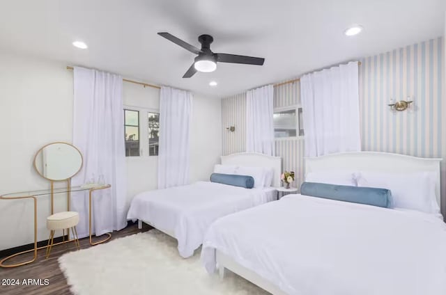 bedroom with hardwood / wood-style floors and ceiling fan