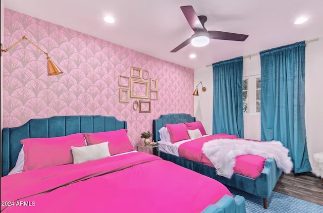 bedroom featuring ceiling fan and hardwood / wood-style flooring