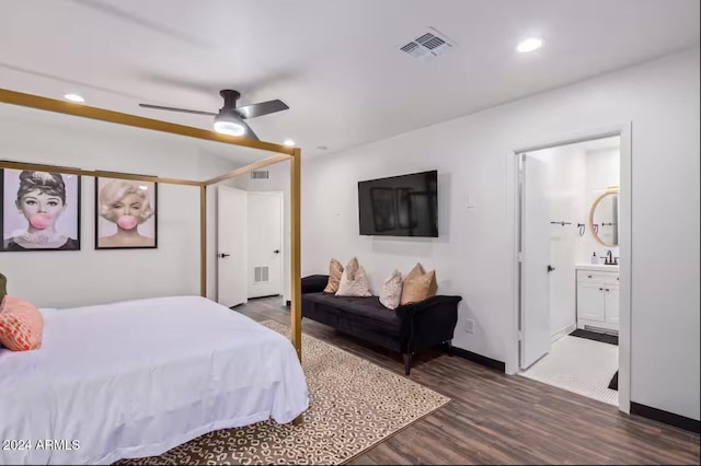 bedroom featuring dark hardwood / wood-style floors, connected bathroom, and ceiling fan