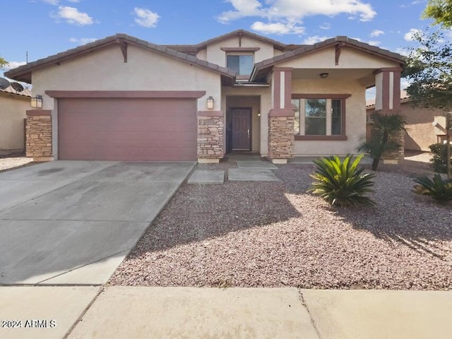 view of front of home with a garage