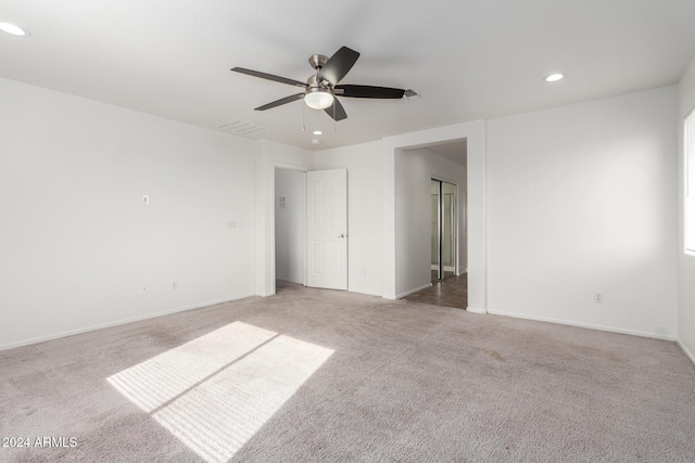 carpeted empty room with ceiling fan