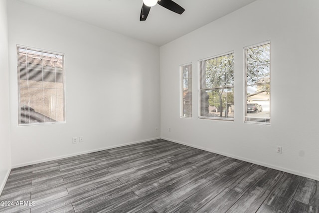 empty room featuring dark hardwood / wood-style floors and ceiling fan