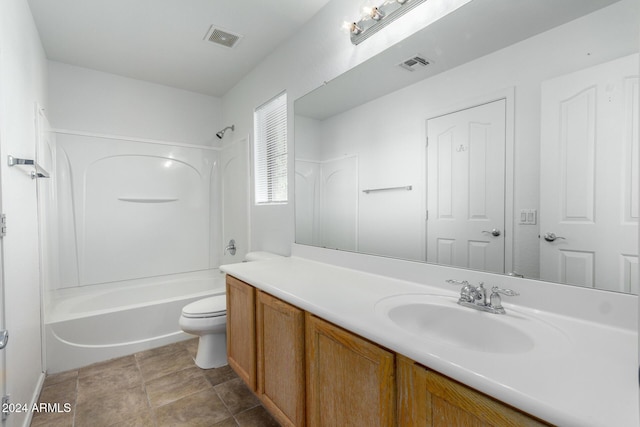 full bathroom featuring tile patterned floors, vanity, toilet, and shower / washtub combination